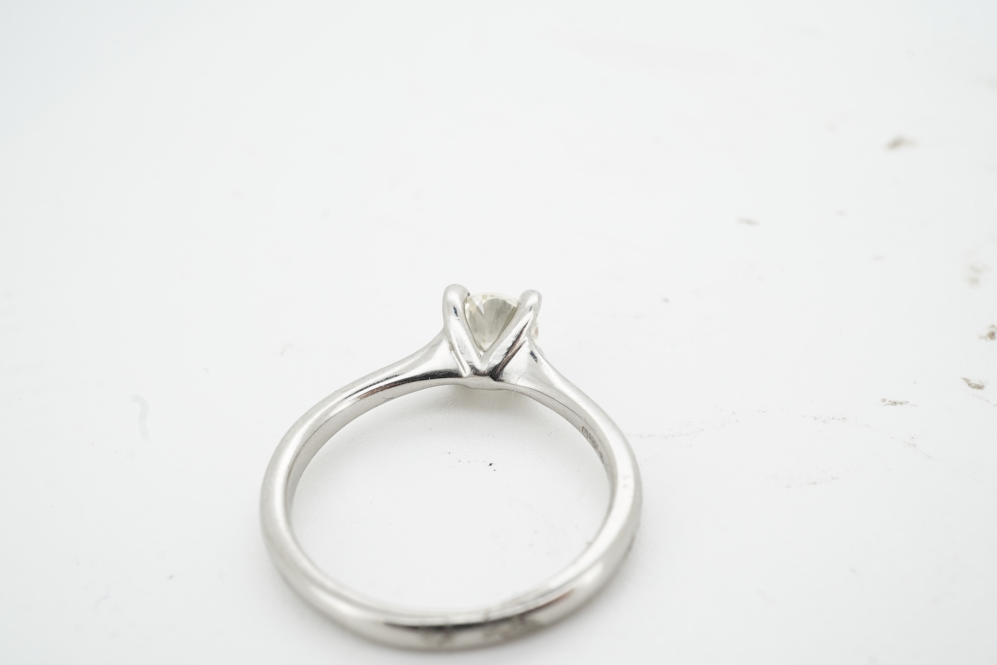 A diamond ring, claw-set with a brilliant-cut diamond weighing approximately 0.50 carats, mounted in platinum, size K, British hallmarks, gross weight approximately 4 grams